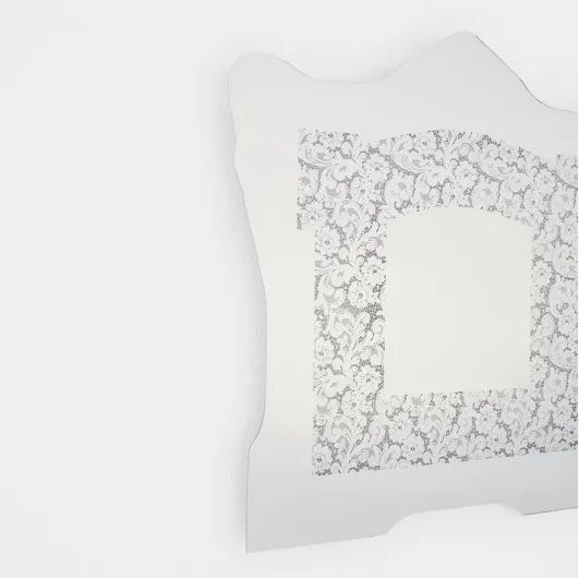 Spizzo mirror with lace insert reflecting Glas Italia mirror.