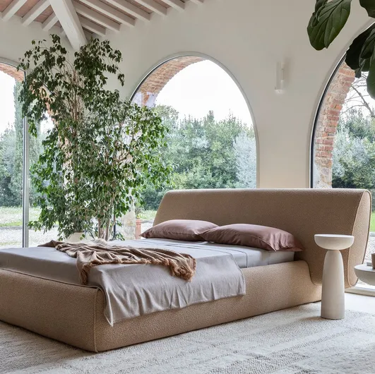 Scultured upholstered double bed Rio by Mogg.