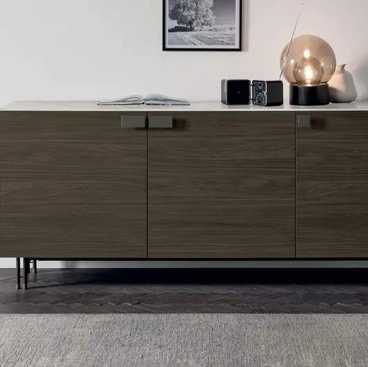 Prometheus sideboard in moka oak and top in Tomasella stoneware.