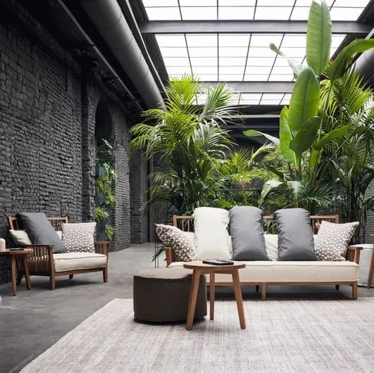 Gray armchair in walnut by Gervasoni