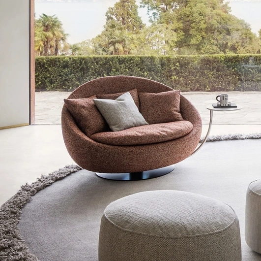 Maxi Lacoon swivel armchair in padded fabric by Desirèe.