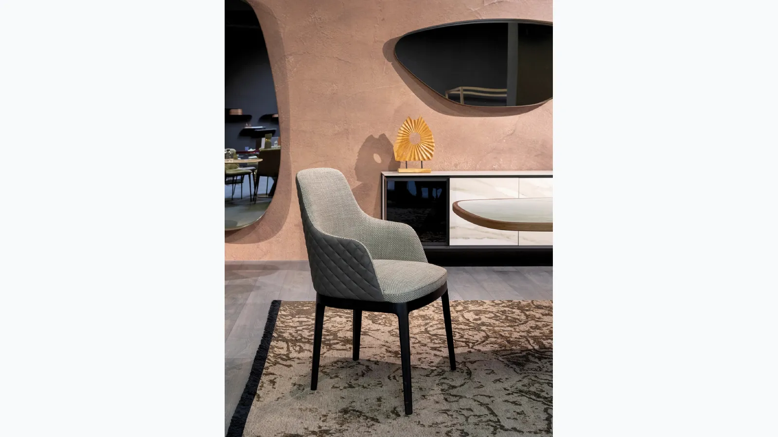 Cleo Elite chair in fabric and quilted leather by Tonin Casa.