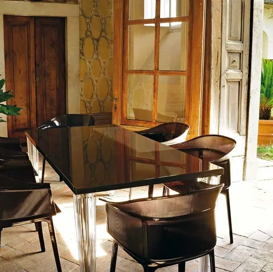 Top Top table with glass top and plexiglass base by Kartell.