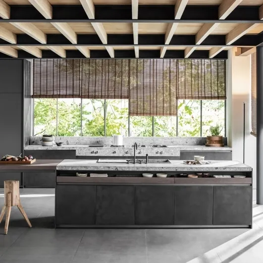Design kitchen with island VVD in railway steel and top in Molteni & C Ceppo stone.