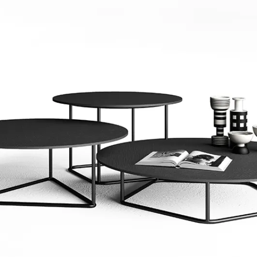Side tables with anthracite Circus concrete tops by Minotti Italia.