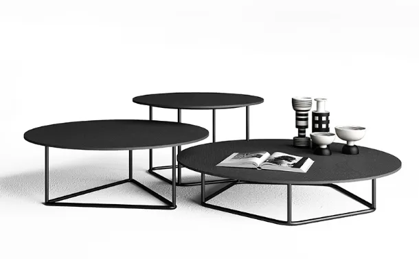Side tables with anthracite Circus concrete tops by Minotti Italia.
