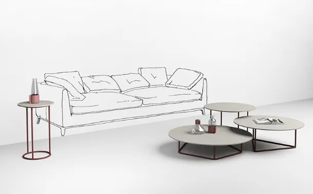 Tables with white concrete top Circus by Minotti Italia.