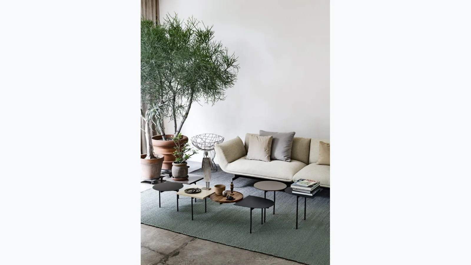 Constellations tables in lacquered wood with a metal structure by Kristalia.
