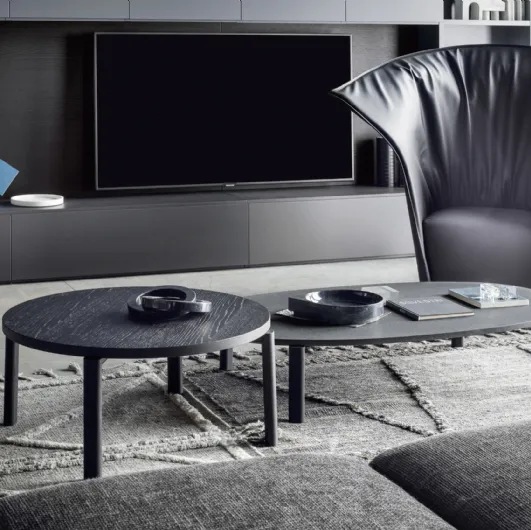 Round wooden coffee table and oval lava stone coffee table Fly by Novamobili.