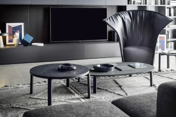 Round wooden coffee table and oval lava stone coffee table Fly by Novamobili.