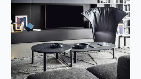 Round wooden coffee table and oval lava stone coffee table Fly by Novamobili.