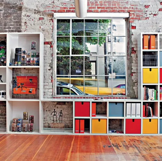Modular plastic bookcase container by Kartell