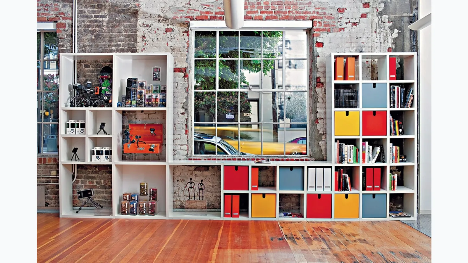Modular plastic bookcase container by Kartell
