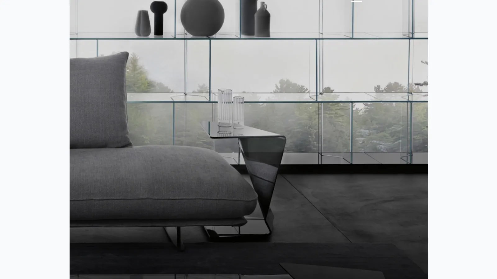 Sigmy coffee table in curved black glass by Fiam.