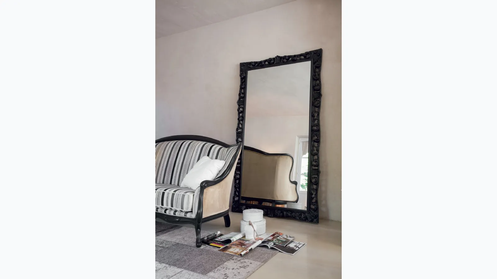 Wide Agrip mirror with floral frame in matte black lacquered wood by Tonin Casa