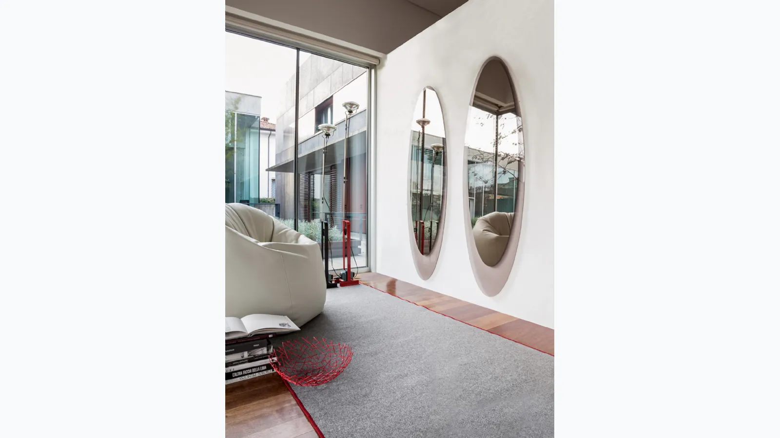 Elliptical Olmi mirror with transparent bronze glass frame by Tonin Casa.