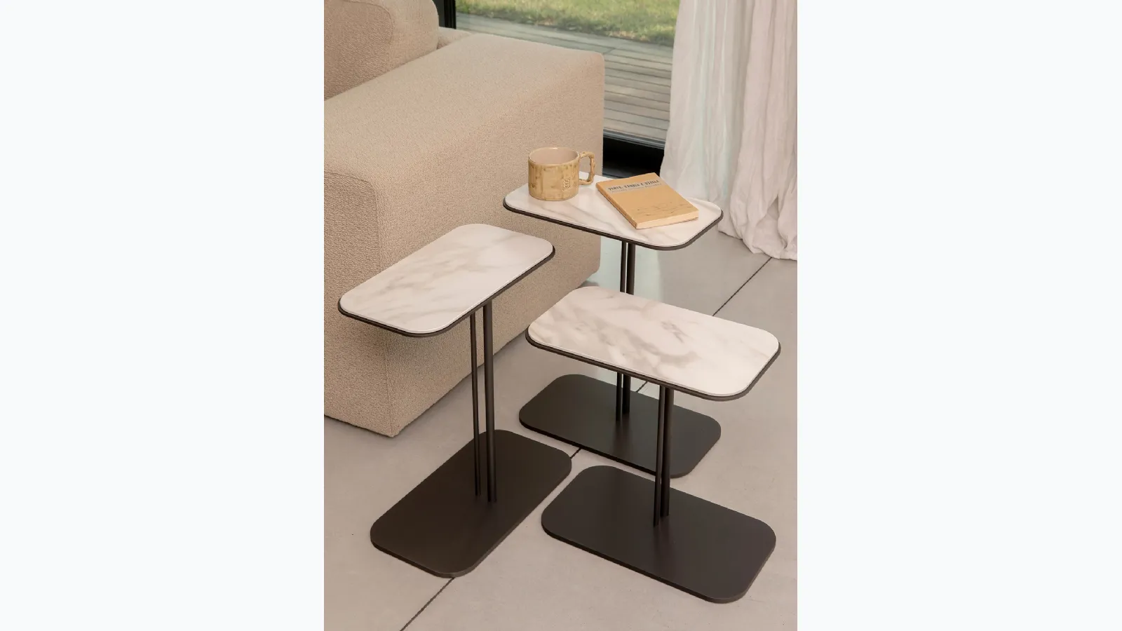 Skyline metal coffee table with porcelain stoneware top by Tonin Casa.
