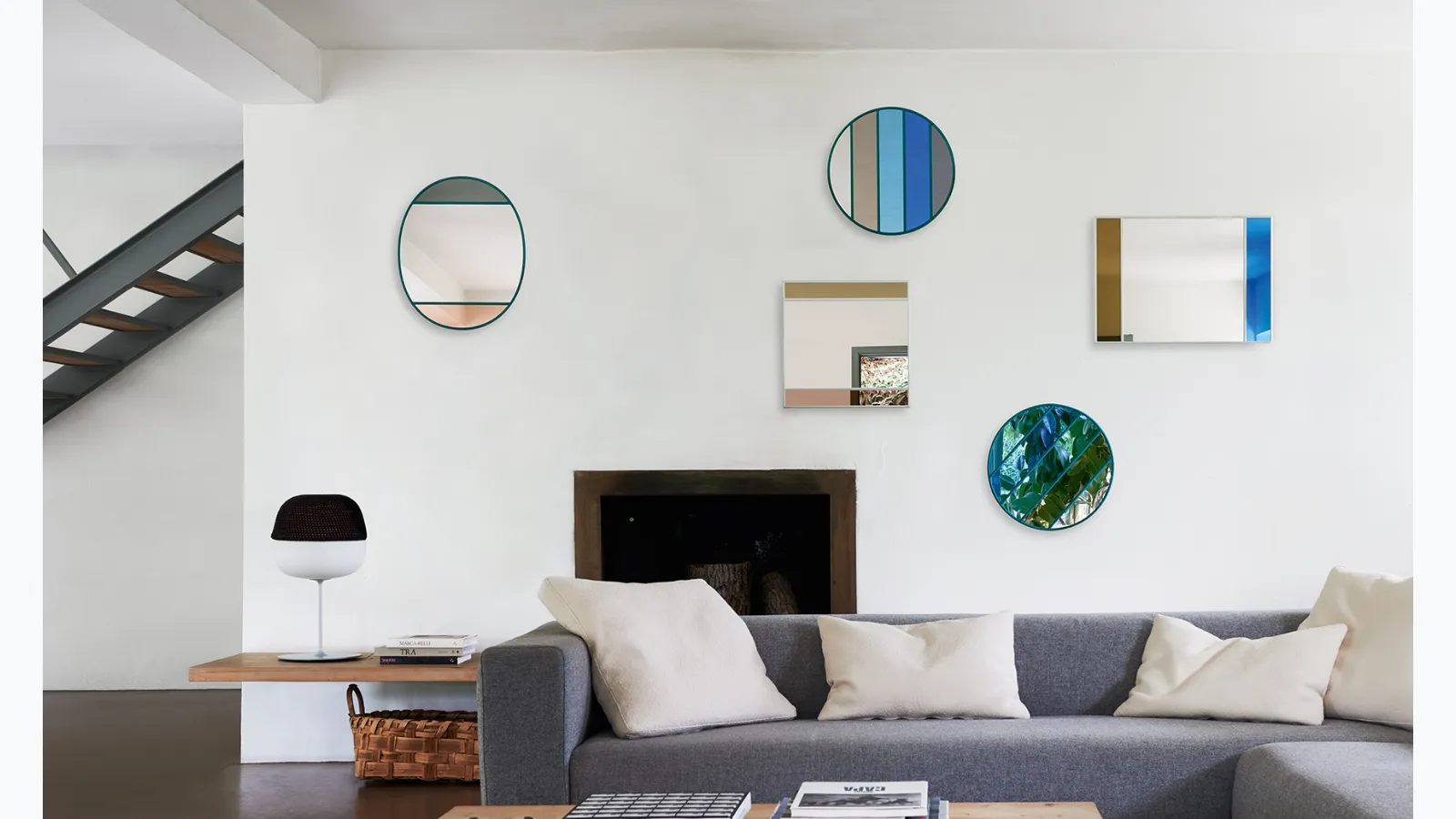 Wall mirrors with rubber frame and glass with colored Vitrail bands by Magis.