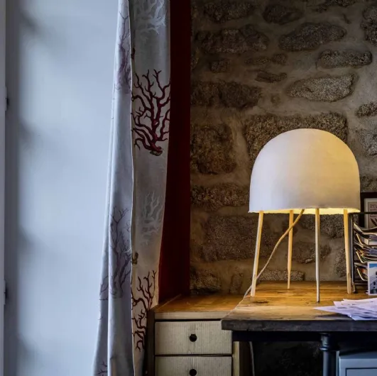 Kurage table lamp in washi paper and ash wood by Foscarini.