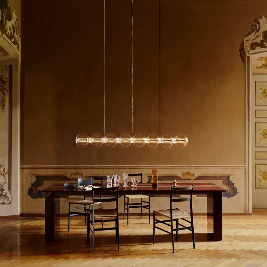 Spherical blown glass suspension lamp by Flos