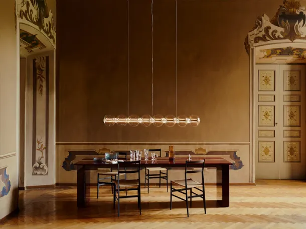 Spherical blown glass suspension lamp by Flos