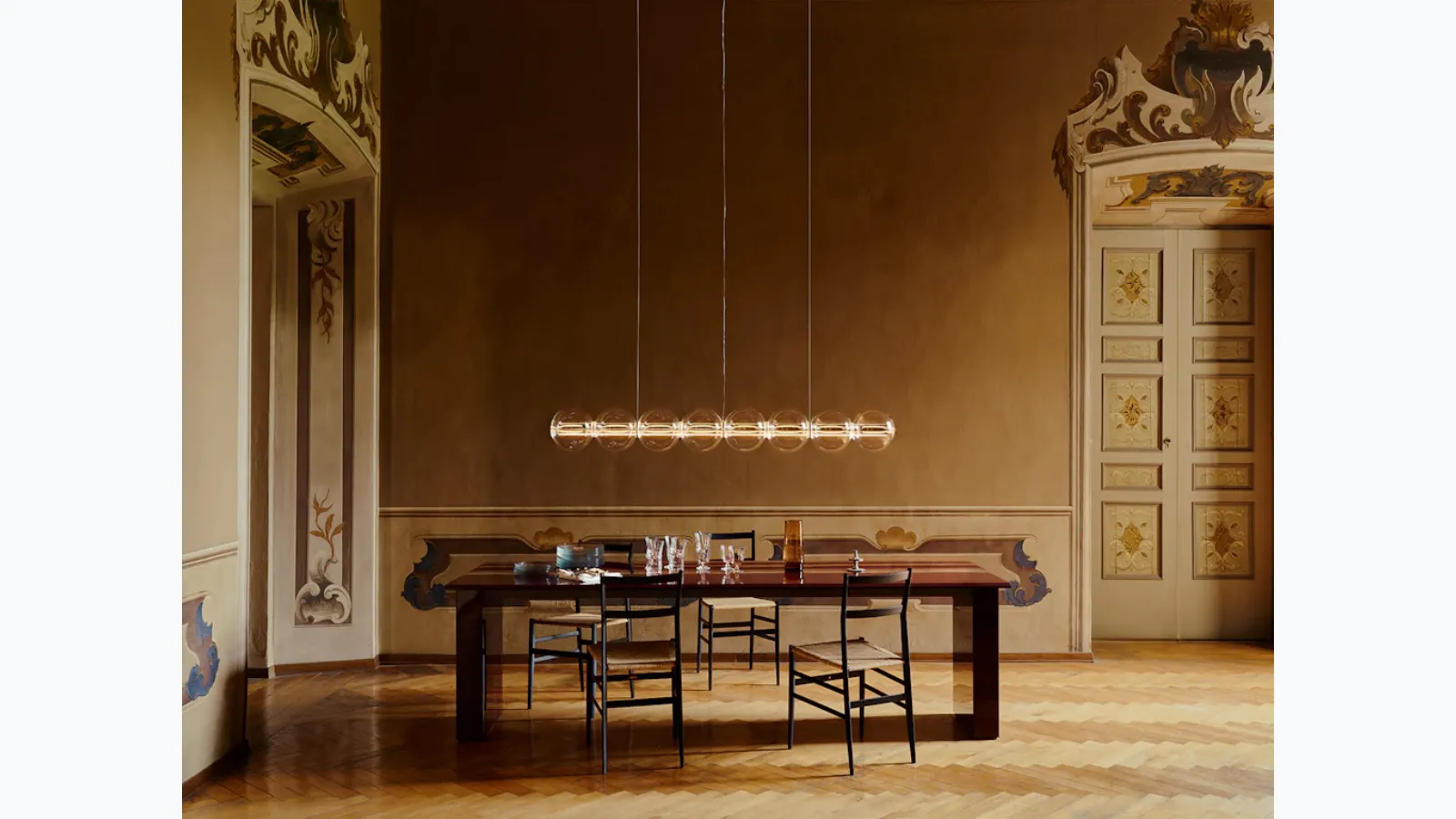 Spherical blown glass suspension lamp by Flos