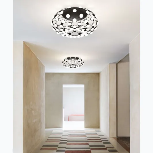 Mesh ceiling lamp with a steel structure and polycarbonate lenses by Luceplan.