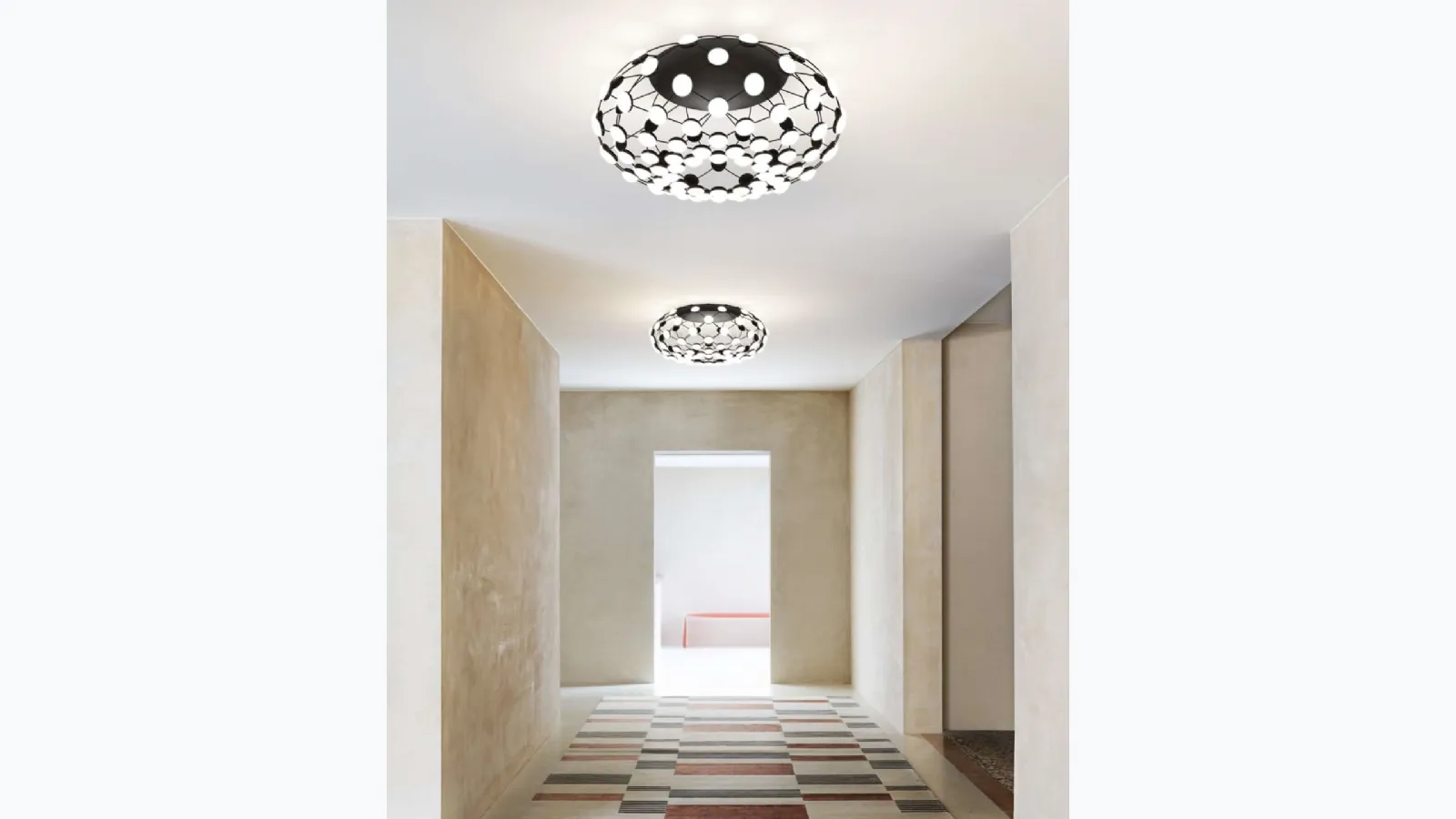 Mesh ceiling lamp with a steel structure and polycarbonate lenses by Luceplan.