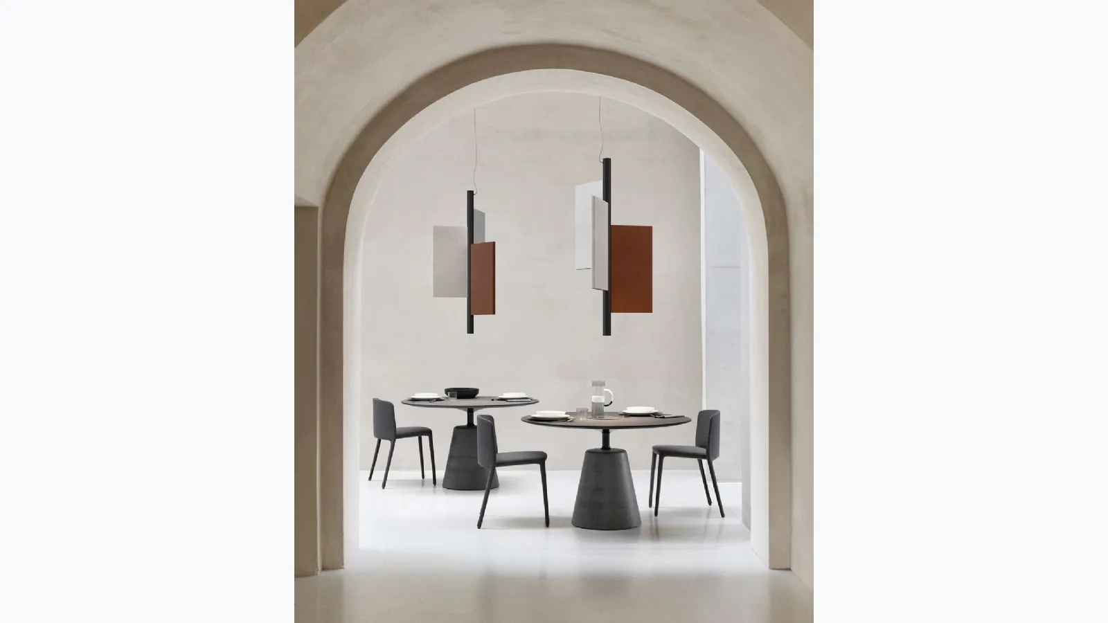 Design suspension lamp with aluminum frame coated in acoustic material and Trypta fabric by Luceplan.