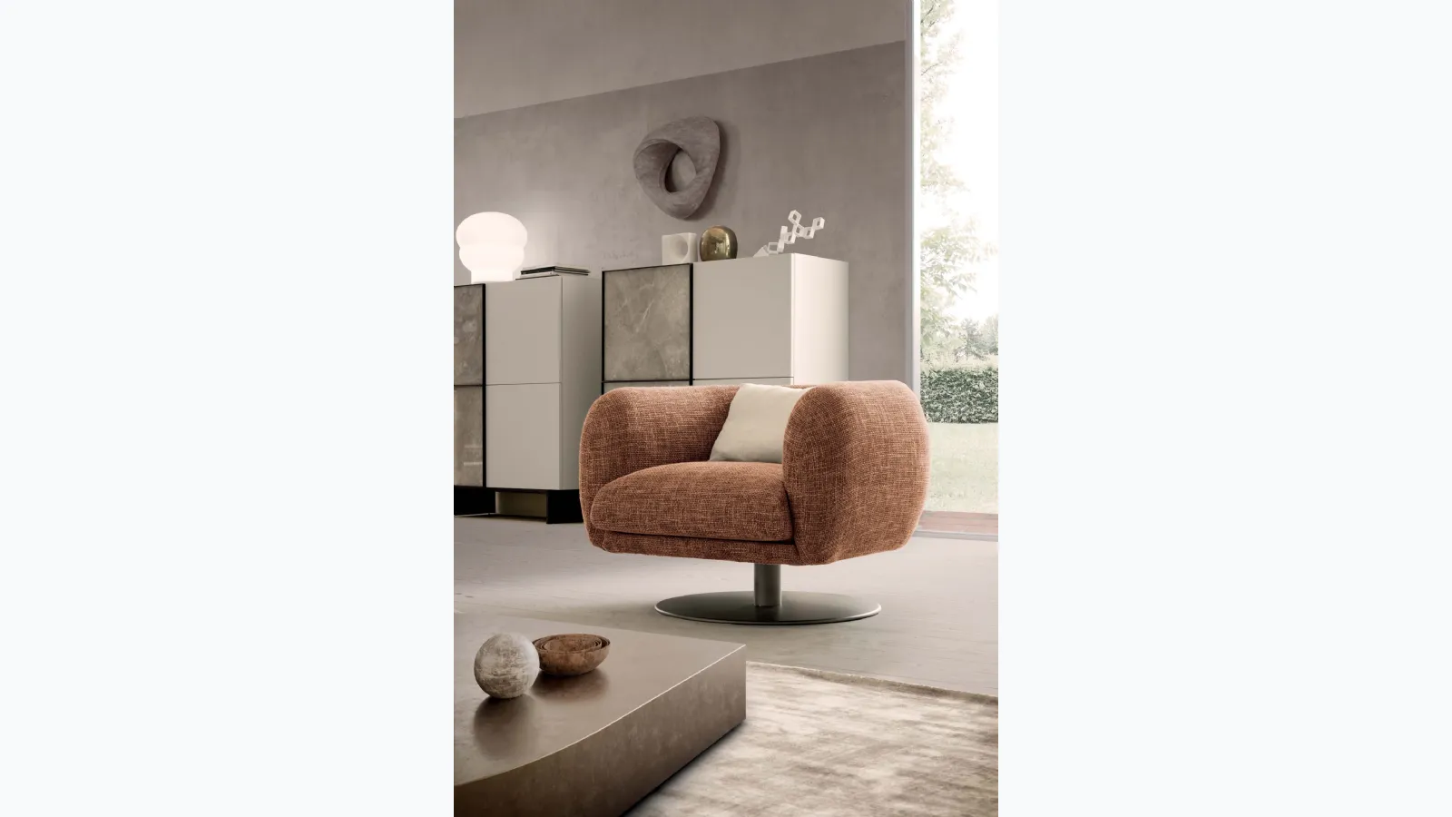 Bali armchair in padded fabric with central metal leg by Presotto.