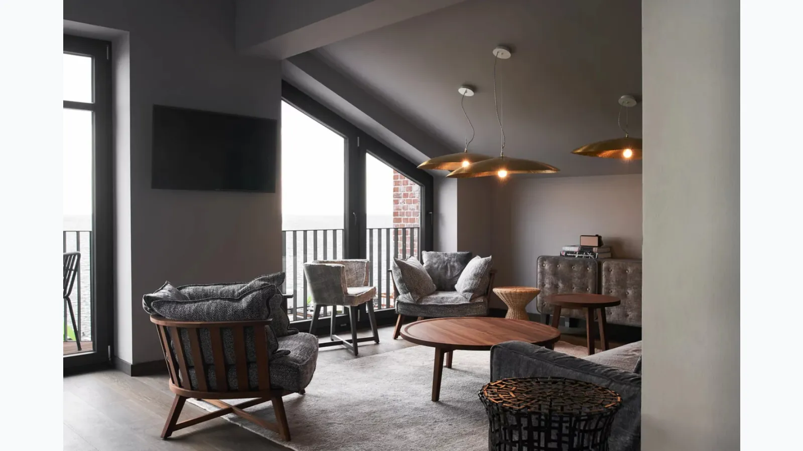 Gray armchair in walnut by Gervasoni