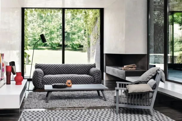 Wooden armchair with Gray upholstered seat by Gervasoni.