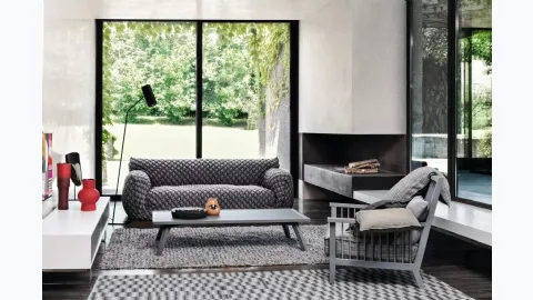 Wooden armchair with Gray upholstered seat by Gervasoni.