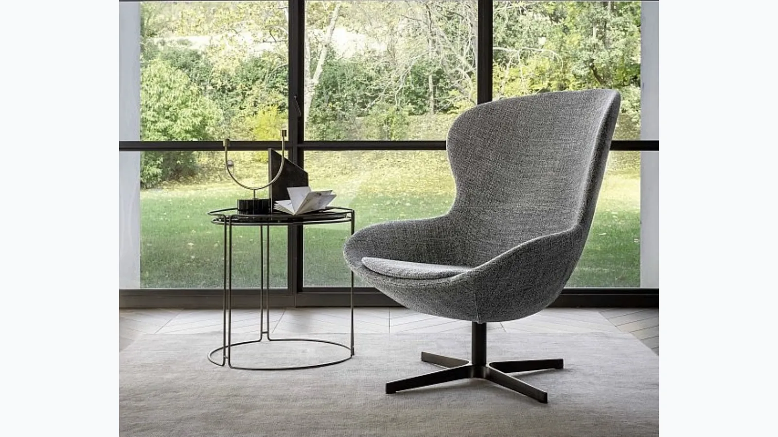 Armchair with enveloping shapes Round in fabric by Ditre Italia.