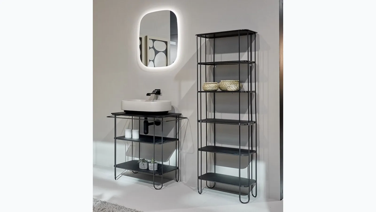 Floor-standing bathroom cabinet with stainless steel wire by Flaminia.