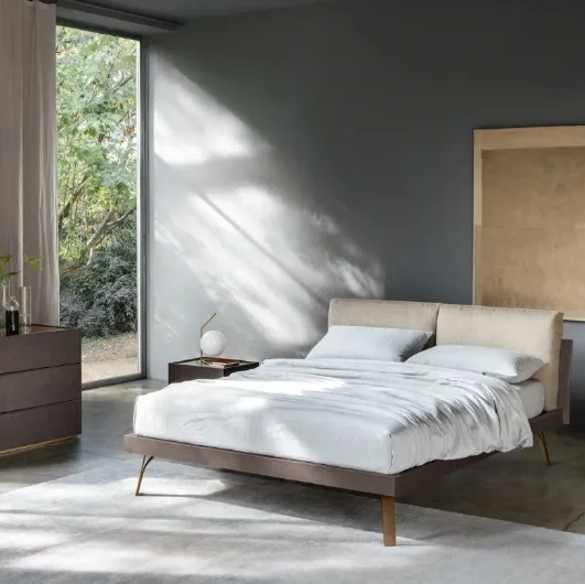 Grafic Bed Hug with headboard and padded cushions by Sangiacomo.