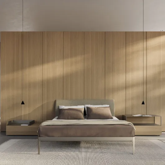 AluAlu Bed by Kristalia is an aluminium bed with a fabric headboard.
