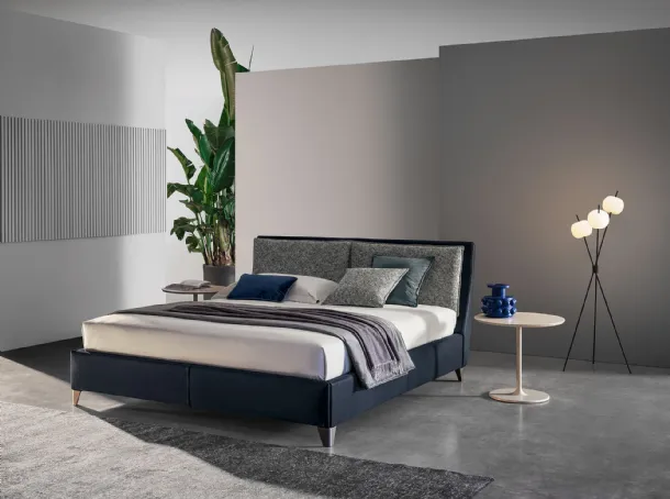 Bed with headboard in Twils' Attico leather and fabric.