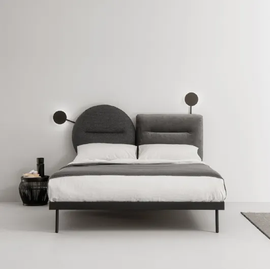 Bed with fabric headboard that can be split into two shapes to be combined with Bishape by Caccaro as desired.