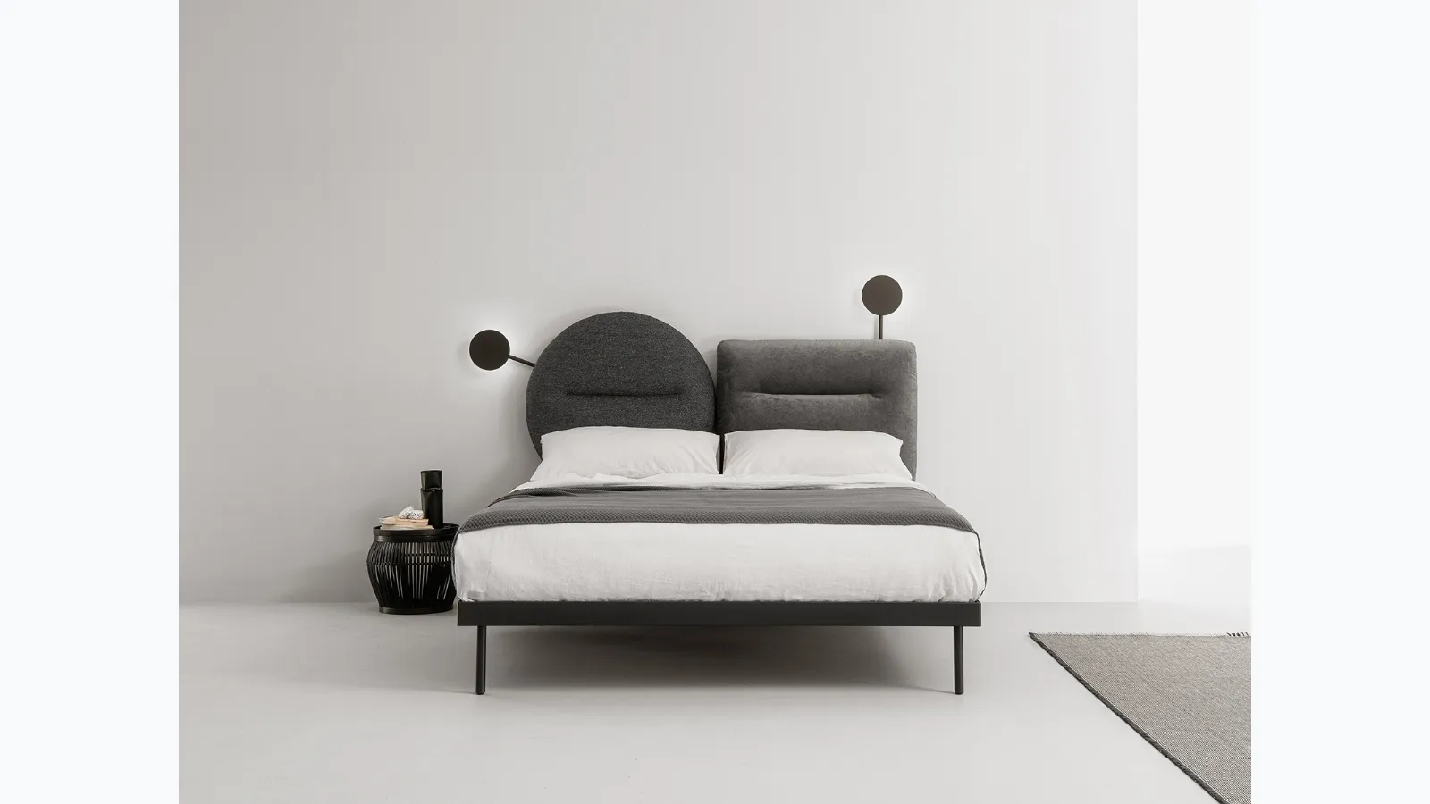 Bed with fabric headboard that can be split into two shapes to be combined with Bishape by Caccaro as desired.