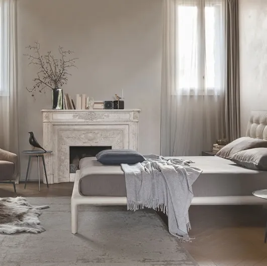Leather bed with quilted and padded headboard Boheme by Alivar.