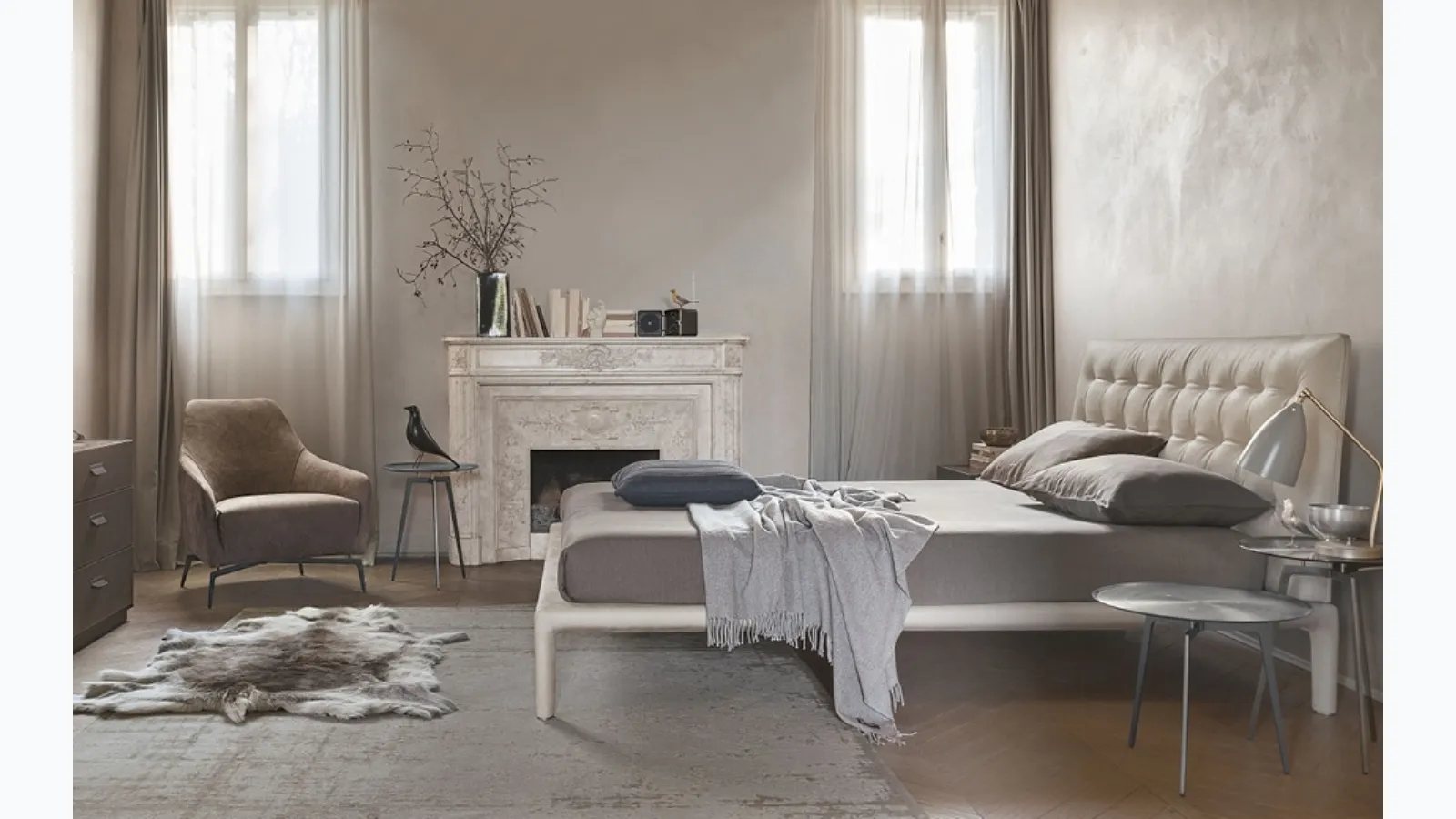 Leather bed with quilted and padded headboard Boheme by Alivar.