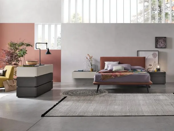 Bravo bed with fabric headboard by Tomasella