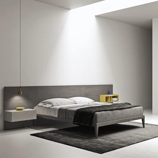 Wooden bed with bun sommier by Kristalia.