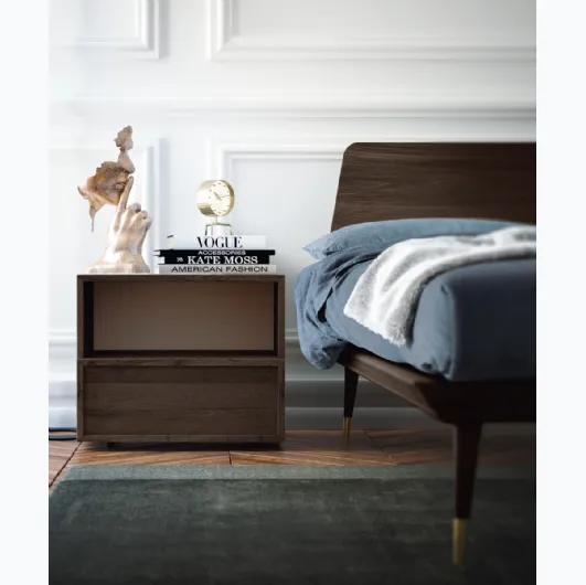 Wooden bed with Callesella headboard.