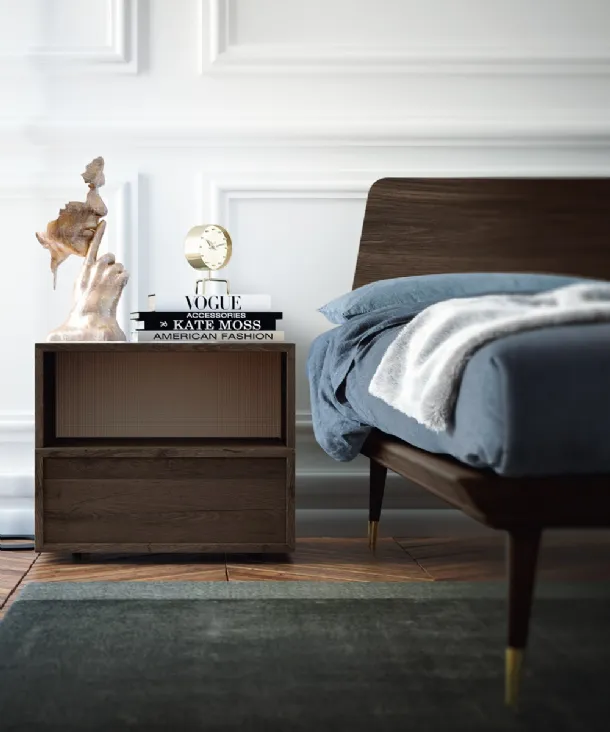Wooden bed with Callesella headboard.