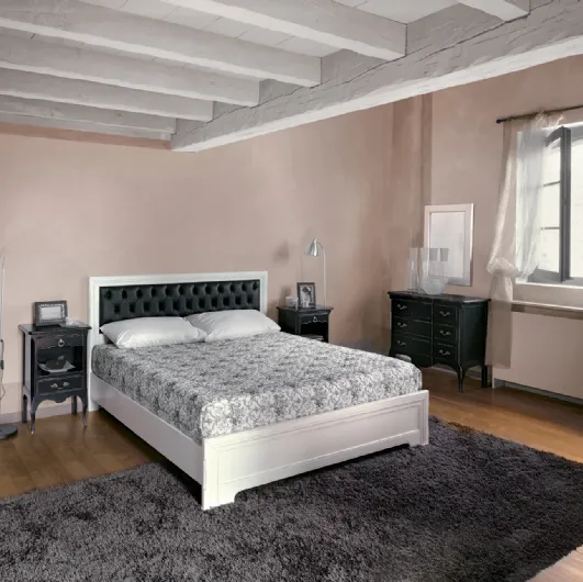 Wooden bed with quilted leather headboard Desiree by Tonin Casa.