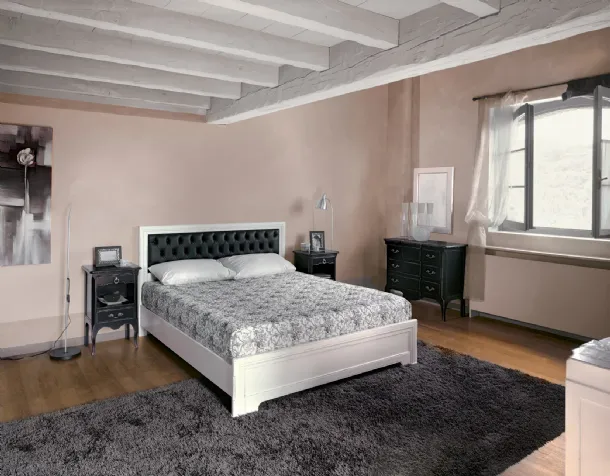 Wooden bed with quilted leather headboard Desiree by Tonin Casa.