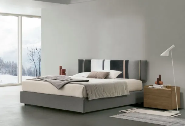 Diagonal bed with storage box and headboard panel by Tomasella.