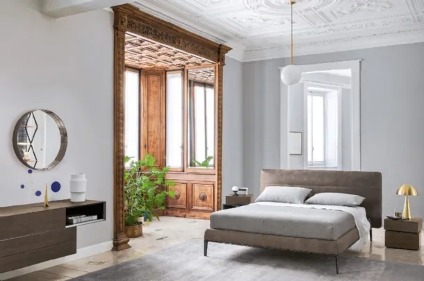 Vintage leather bed with Gaston headboard by Sangiacomo.